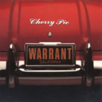 The trunk of a red car with a shiny silver bumper. "Cherry Pie" is written on the trunk; the license plate says WARRANT.