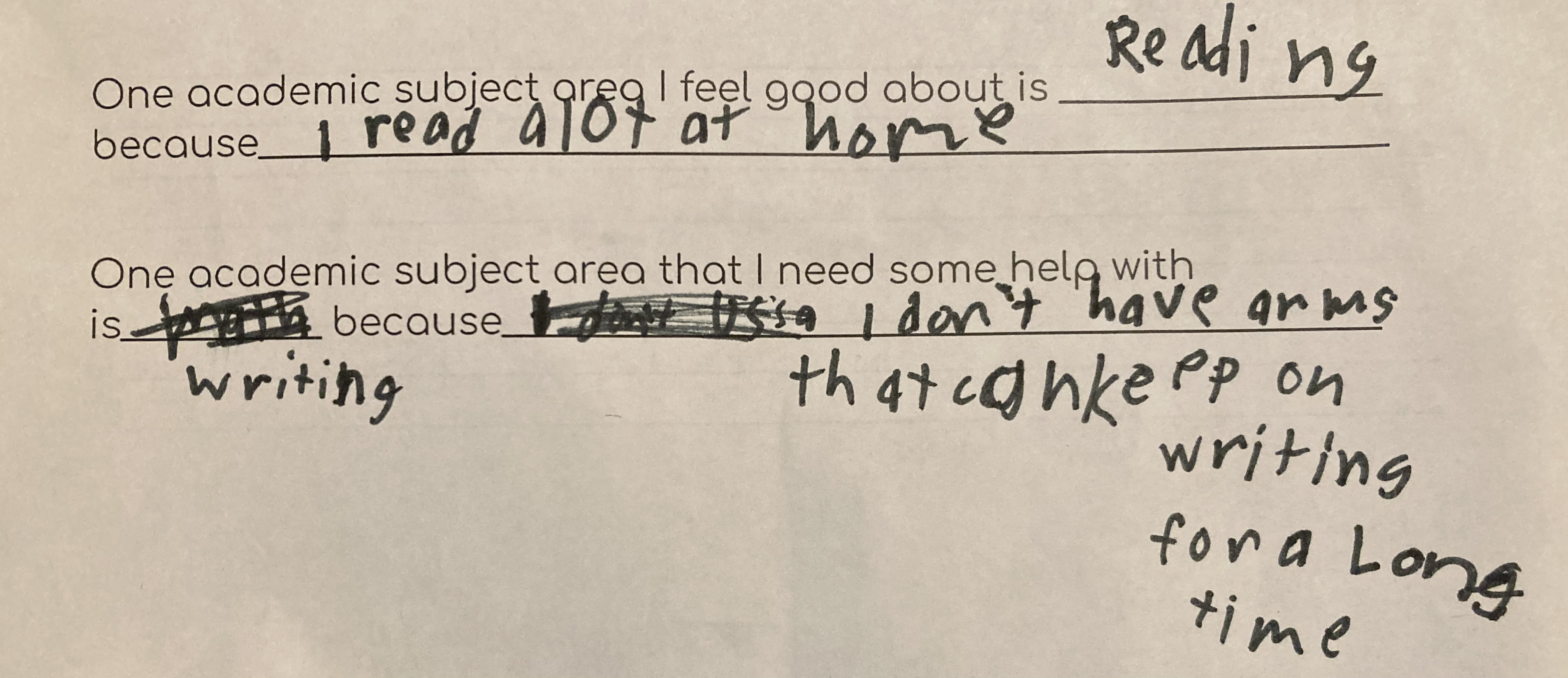 A photo of a child's handwriting on a printed form. The printed form says "One academic subject area that I need some help with is ___ because ___." The first blank is filled in with "writing." The second blank is filled in with "I don't have arms that can keep writing for a long time."